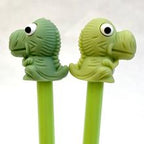 Two green T-Rex dinosaur gel pens on sticks for BCmini 22259, front view