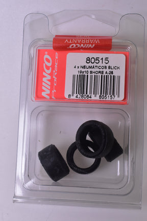 Four black slick tires for slot cars, packaged in a clear plastic case for NINCO Slot Cars 80515