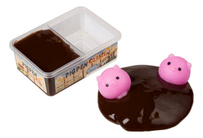 Brown slime with three pink pig toys on top for Toy Smith 5782