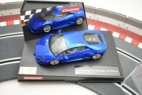 Blue Lamborghini Huracán model car displayed on a black base for Carrera 27514
