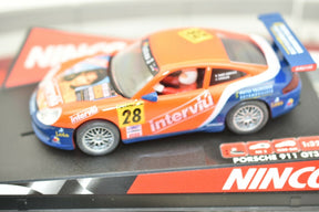Orange and blue Porsche race car model on a track base for Ninco 50259