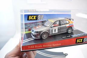 Slot car of a 2002 Cup Seat Leon race car on a display base for SCX 60930