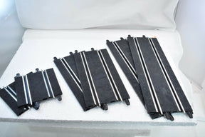 Assortment of black and white track pieces for 1/43 scale model train sets for SCX Compact 303057980155