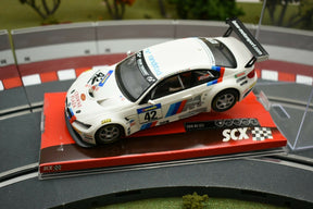White scale model BMW M3 GT2 race car on a display base for SCX A10156X3U0