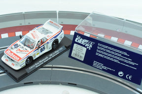 Slot car of a 1982 Lancia Beta Montecarlo race car on a track section for Fly Car 07501