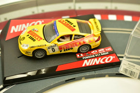 Yellow slot car of a Porsche 911 German Rally car for Ninco 50256