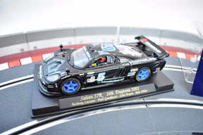 Slot car of a 2001 Saleen S7R race car on a display base for Fly Car 88015, front view