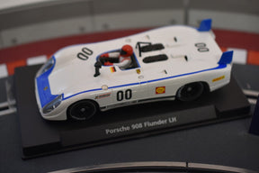 White race car model, Porsche 908 Flunder LH, displayed on a stand for Fly Car 88121