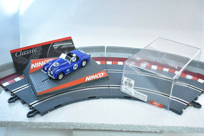 Blue Jaguar slot car on a track section with "Classic NINCO" branding for ZZ Expired Kim Collection 50520