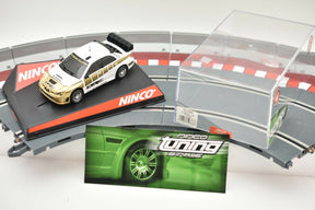 Subaru race car toy set with track pieces and style guide for NINCO 50388