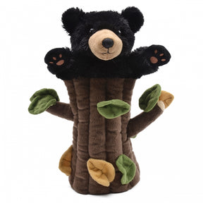 Black bear puppet hugging a brown, textured tree trunk for Unipak 7199