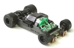 Black remote-control chassis with four wheels and visible electronics for AFX/Racemasters 21029