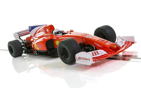 Red racing car model, low angle view, on a white surface for Scalextric C3958