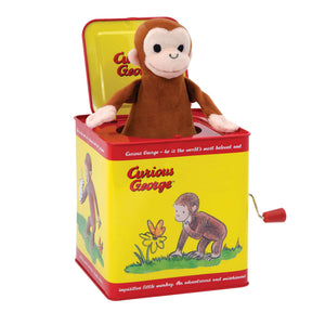 Stuffed monkey toy emerging from a yellow, red jack-in-the-box for Schylling CJB