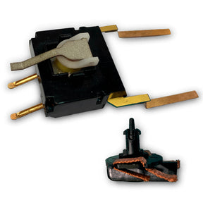 Electronic component kit showing a black module and a small connector piece for SCX Advance E10300X200
