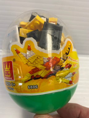Dinosaur building blocks inside a clear, egg-shaped container for IMEX Model Company WAG68016