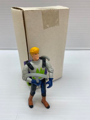 Action figure of Jonny Quest in costume, standing near a cardboard box for Galoob 74843