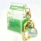 Green milk-themed key charm with a clear, round bead for BC Mini 12058