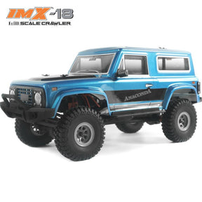 Blue 1:18 scale crawler vehicle with large off-road tires for IMX IMX25005, front view