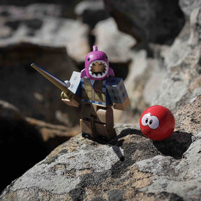 Fisherman minifigure with fishing rod and red ball on rocks for UCC 39683
