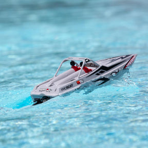 Silver remote-controlled jet boat speeding across blue water for Pro Boat PRB08045T1, front view