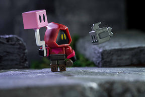 Roblox minion figure with pink box accessory near a floating gray figure for UCC 00406
