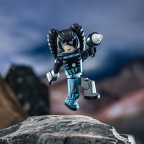 Action figure of Zara the Cyborg, posed mid-air against a rocky backdrop for UCC 41035