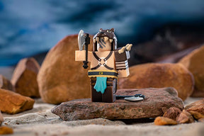 Miniature warrior figure with axe, standing on rocks by the water for UCC 41036
