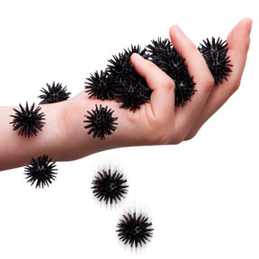 Hands covered in black, spiky, alien-like creatures for Schylling SCRT