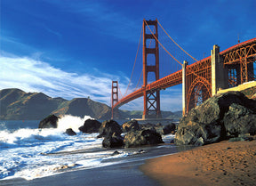 Bright red bridge spans the bay at the beach under a blue sky for Tomax TOM50-044