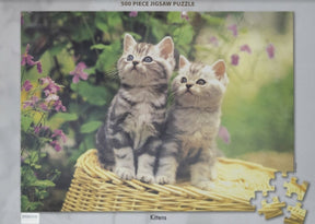 Two playful kittens sit together in a woven basket surrounded by flowers for Tomax TOM50-091