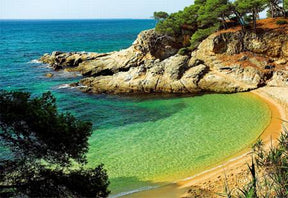 Turquoise bay meeting rocky coast under bright sky for Trefl TRF26091