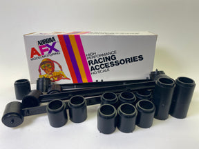 Black modular bridge beams and four black cylindrical pieces for model trains for Aurora AFX 1599, front view