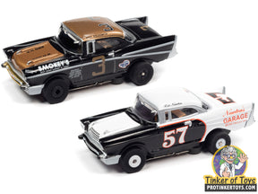 Two slot cars: a gold/black 1950s Chevy and a white/black 1957 Chevy for Auto World CP7960