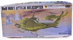Green Huey attack helicopter model kit box art showing the aircraft in action for Revell Model Co H-259