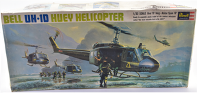 Model kit box art showing Bell UH-1D Huey helicopter in action for Revell Model Co H-266