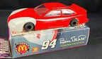 Red and white 1/24 scale T-Bird race car on its display box for Parma 448SE