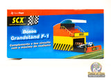 Scale model display for F-1 racing, featuring grandstands and pit boxes for SCX 88260