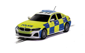Yellow and blue police car model on a track for Scalextric C4165T
