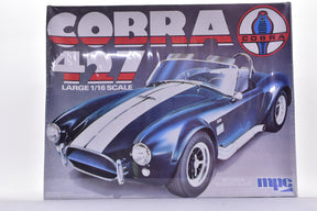 Blue and white Cobra 427 model kit box art for MPC 3082