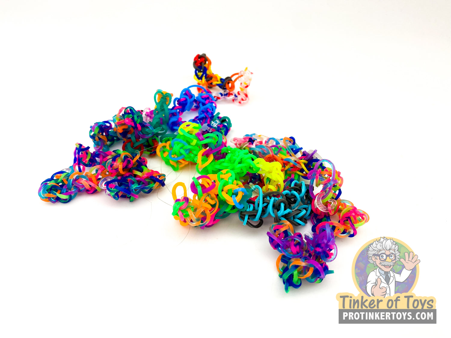 Assorted colorful rainbow loom bracelets spread on white background