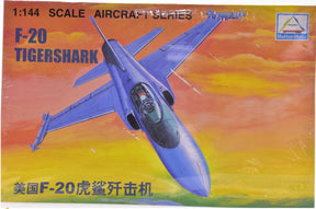 Blue F-20 Tigershark jet model against a vibrant sunset sky for MiniHobbyModels 80424