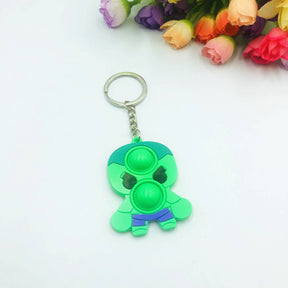 Green pop-it fidget keychain toy with a ring attachment for Faire FH2928