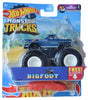 Blue monster truck toy with large wheels and a free red car accessory for Mattel FYJ44