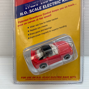 Red slot car in clear plastic packaging for Life-Like Racing Max-Traxx 9736
