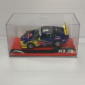 Slot car of a blue and yellow Porsche 911 GT3 Cup race car for SCX A10119X3U0