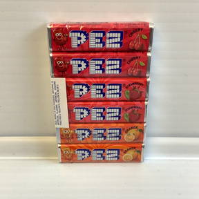 Stack of colorful Pez candy refill boxes featuring cherry, strawberry, and orange flavors for Nassau Candy 19556