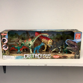 Dinosaur set box art showing various prehistoric reptiles in a jungle scene for IMEX Model Company IMX49011