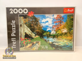 Jigsaw puzzle: Bavarian Alps scene with a church by a river for Trefl TRF27061