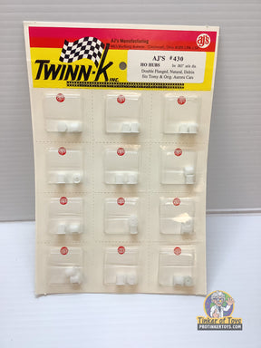 Assortment of small, white plastic hubs for model train axles for HO Hubs for .063" axle dia 430